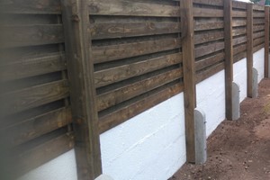 Hit & miss privacy wooden fence panels missing out every other paling board each opposing side of the panel in a serial line constructed in horizontal, diagonal or vertical fencing style baton framed.