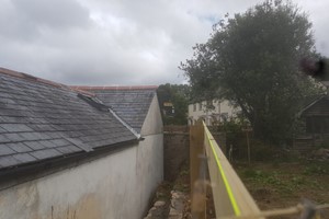 To achieve a straight fence line, plumb level the start & end posts, ensure cement has set. Fix a tight string line at equal post points. Use a long spirit level to plumb each post at the string line. 