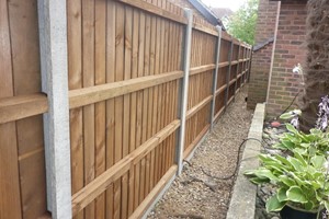 No legal obligation who gets the good fence side other than the whole fence is within the boundary. However, posts and rails need periodic checks for rot & these are structural supports of this style.