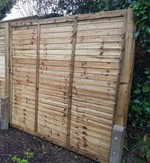 dark wood fence in garden