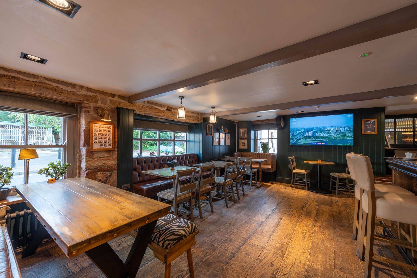 wooden tables and chairs in the pub