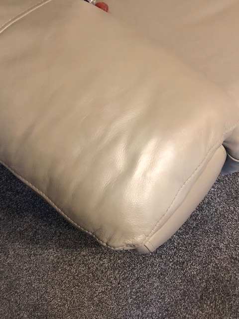 DFS, Peeling leather cosmetic repair on armchair, after