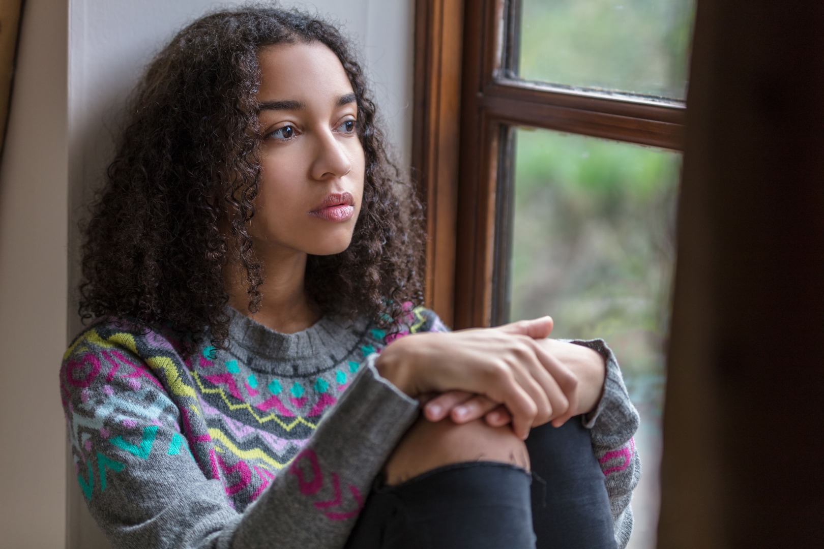 girl sitting by the window
