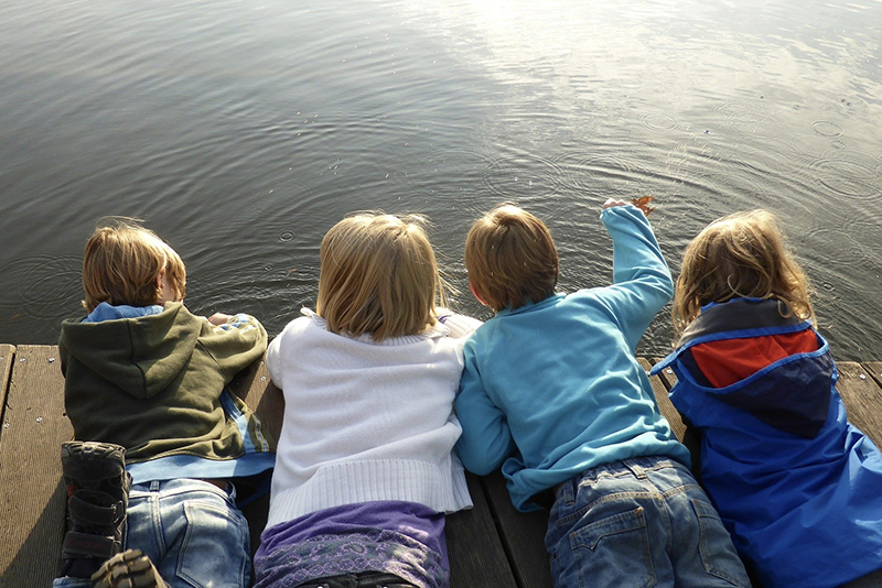kids by a lake