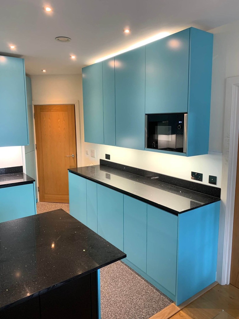 blue kitchen design with bespoke panels
