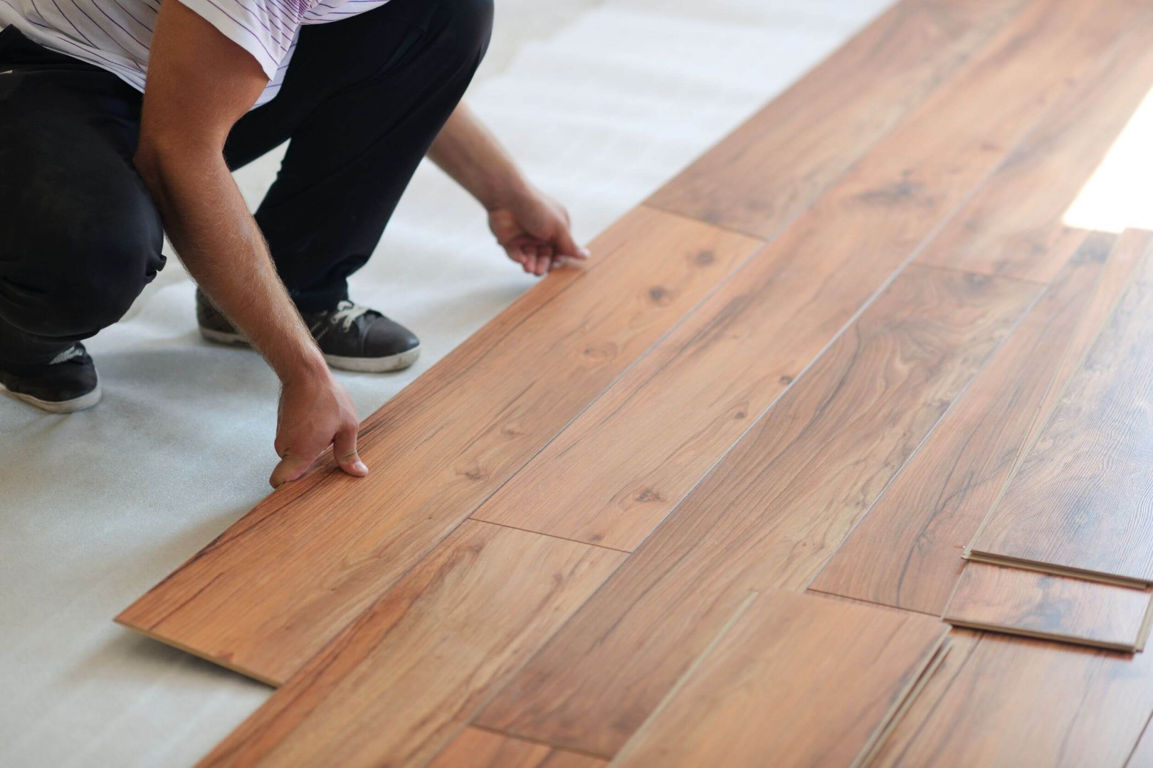 laying down flooring