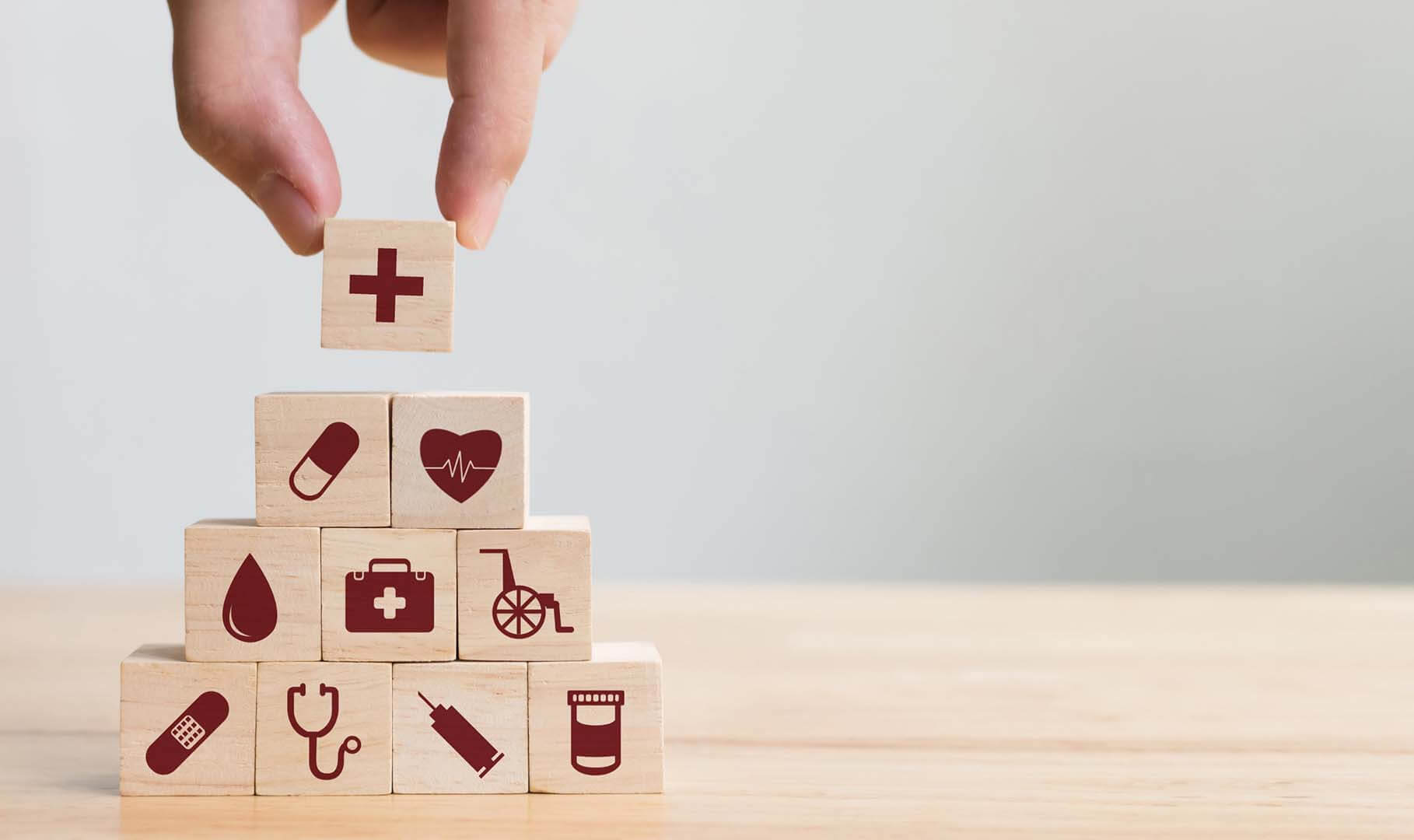 healthcare symbols on wooden blocks