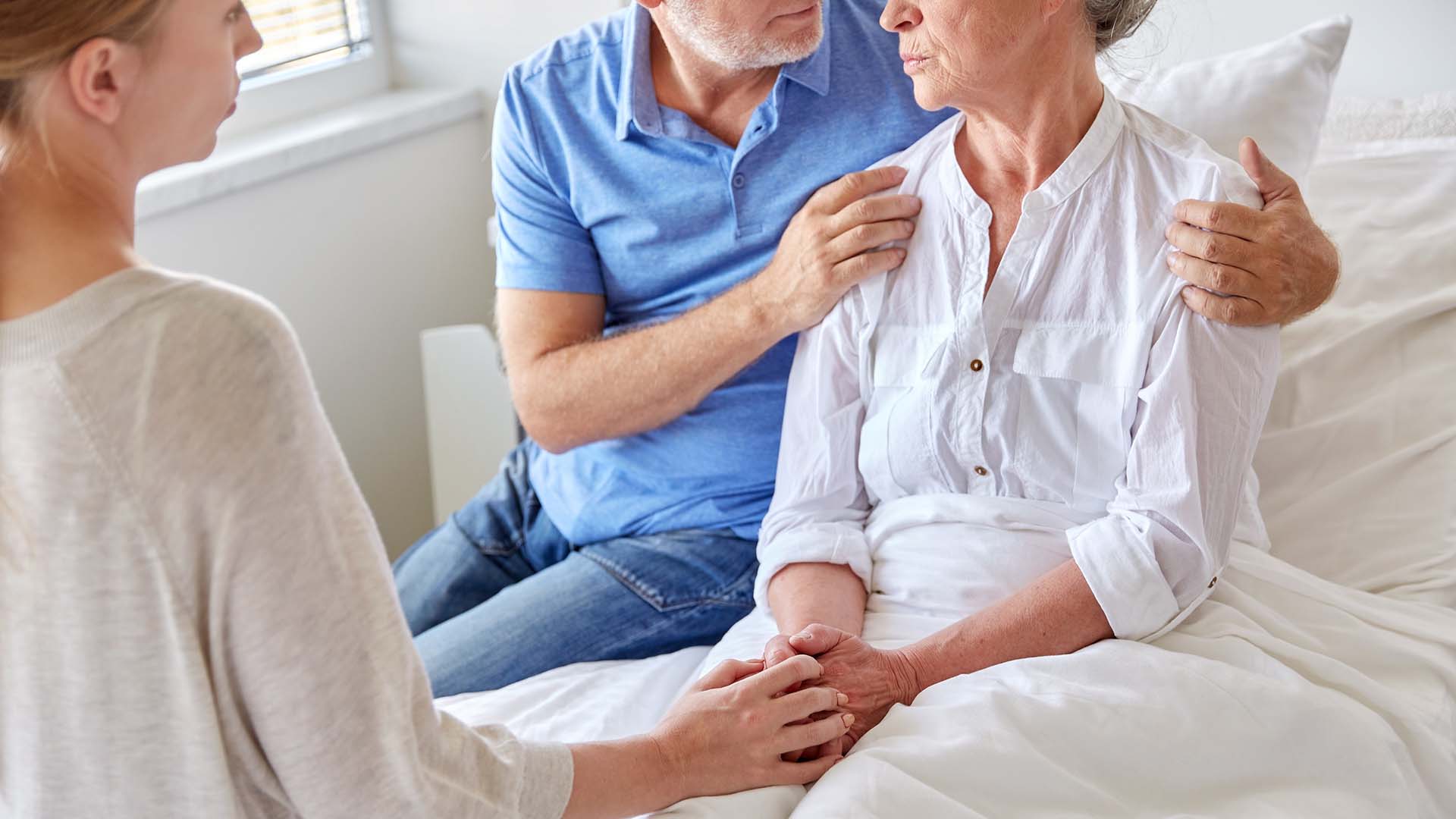 Family visiting senior woman