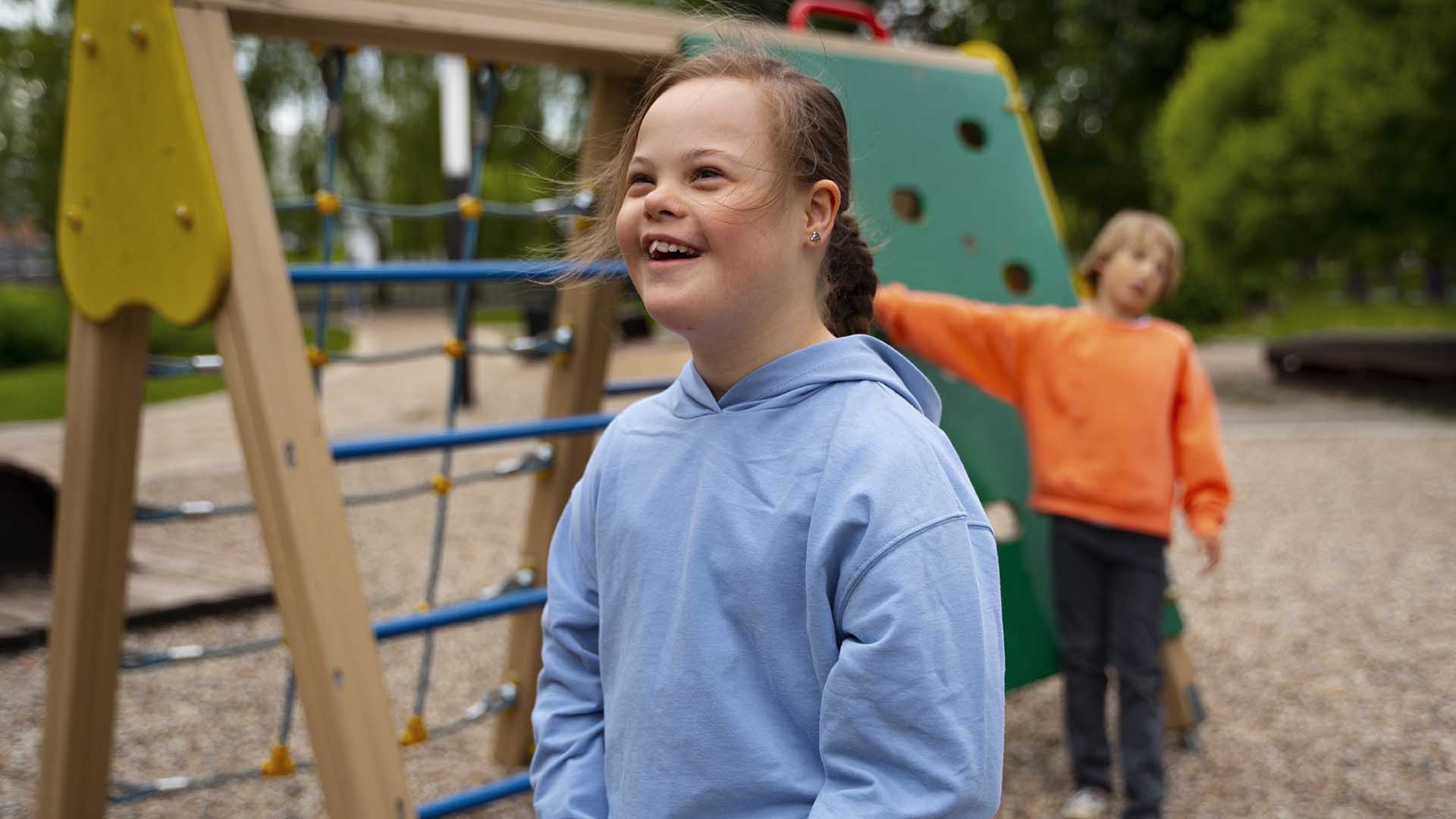 Side view smiley girl with down syndrome