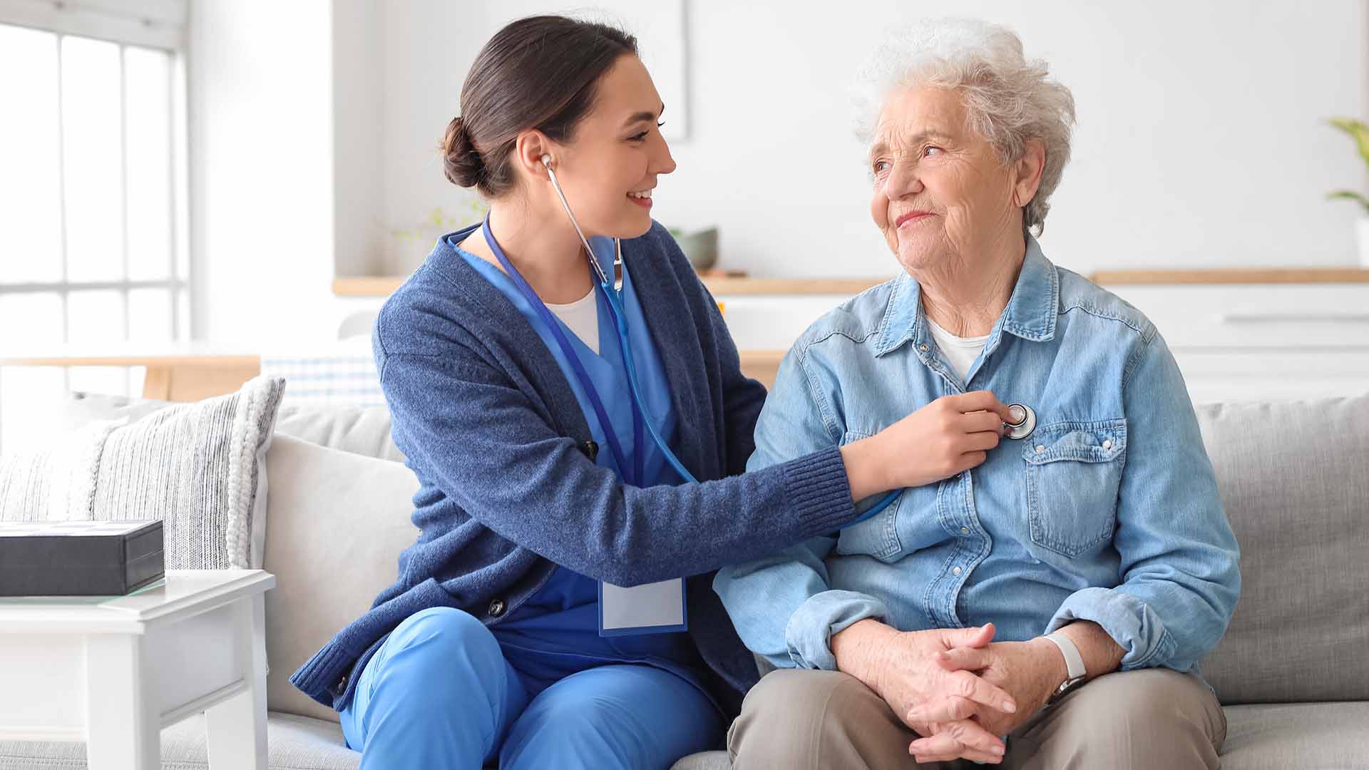 Nurse caring for a senior woman