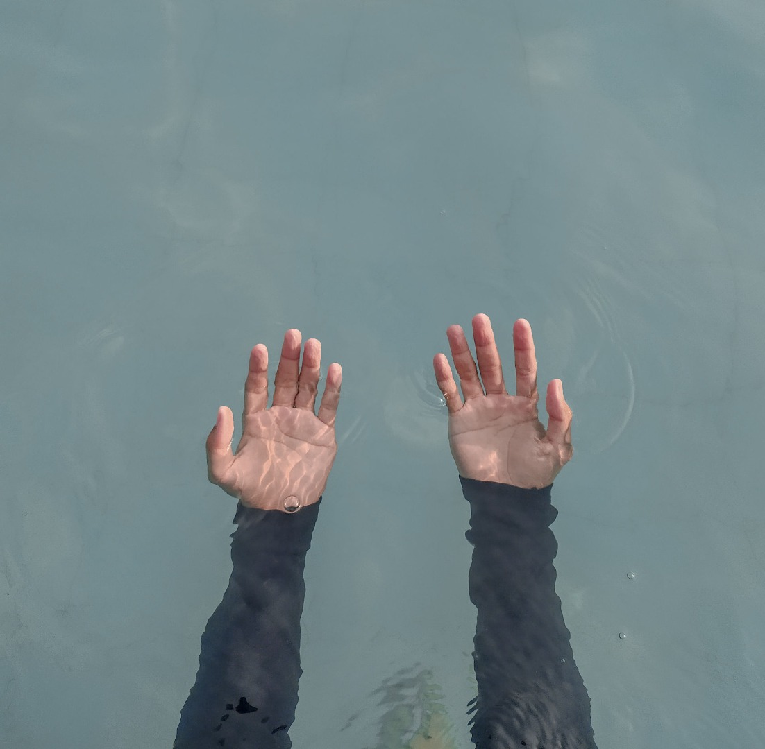 hands in water beating benzos