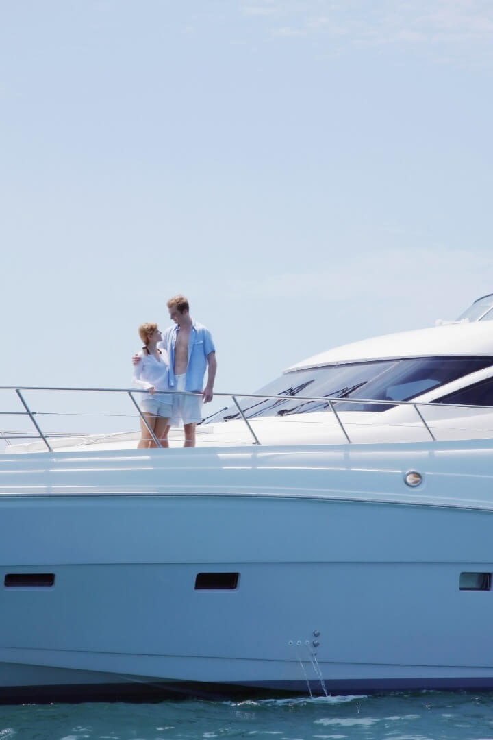 couple on big motor yacht