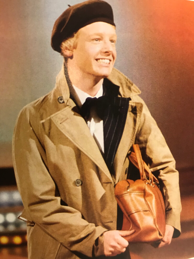 les Dennis in a beret with satchel