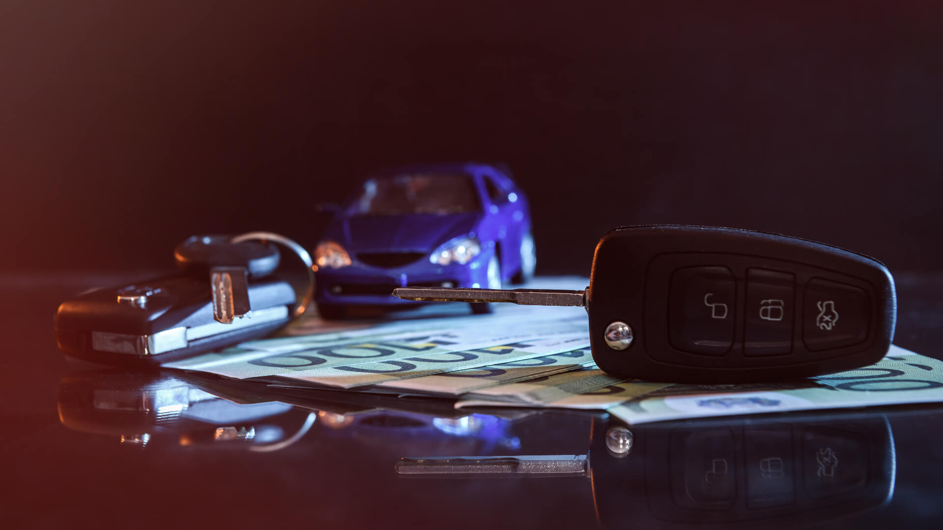 Car and keys on banknotes