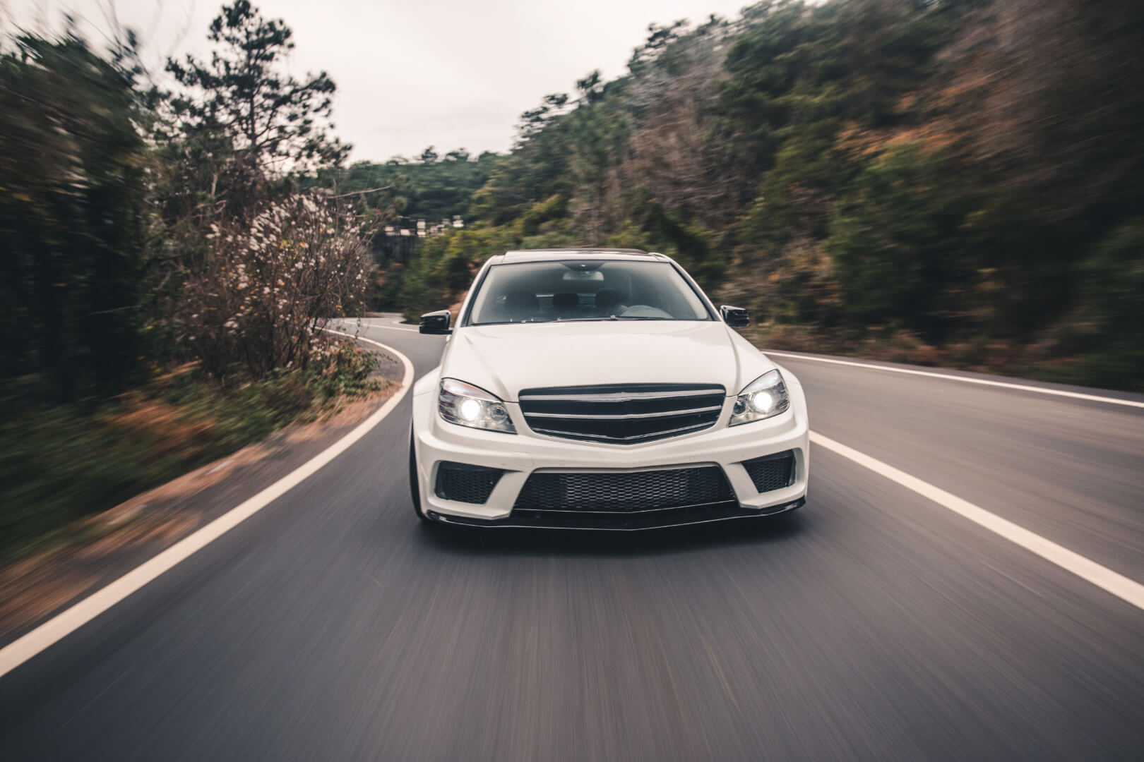 High speed white sedan