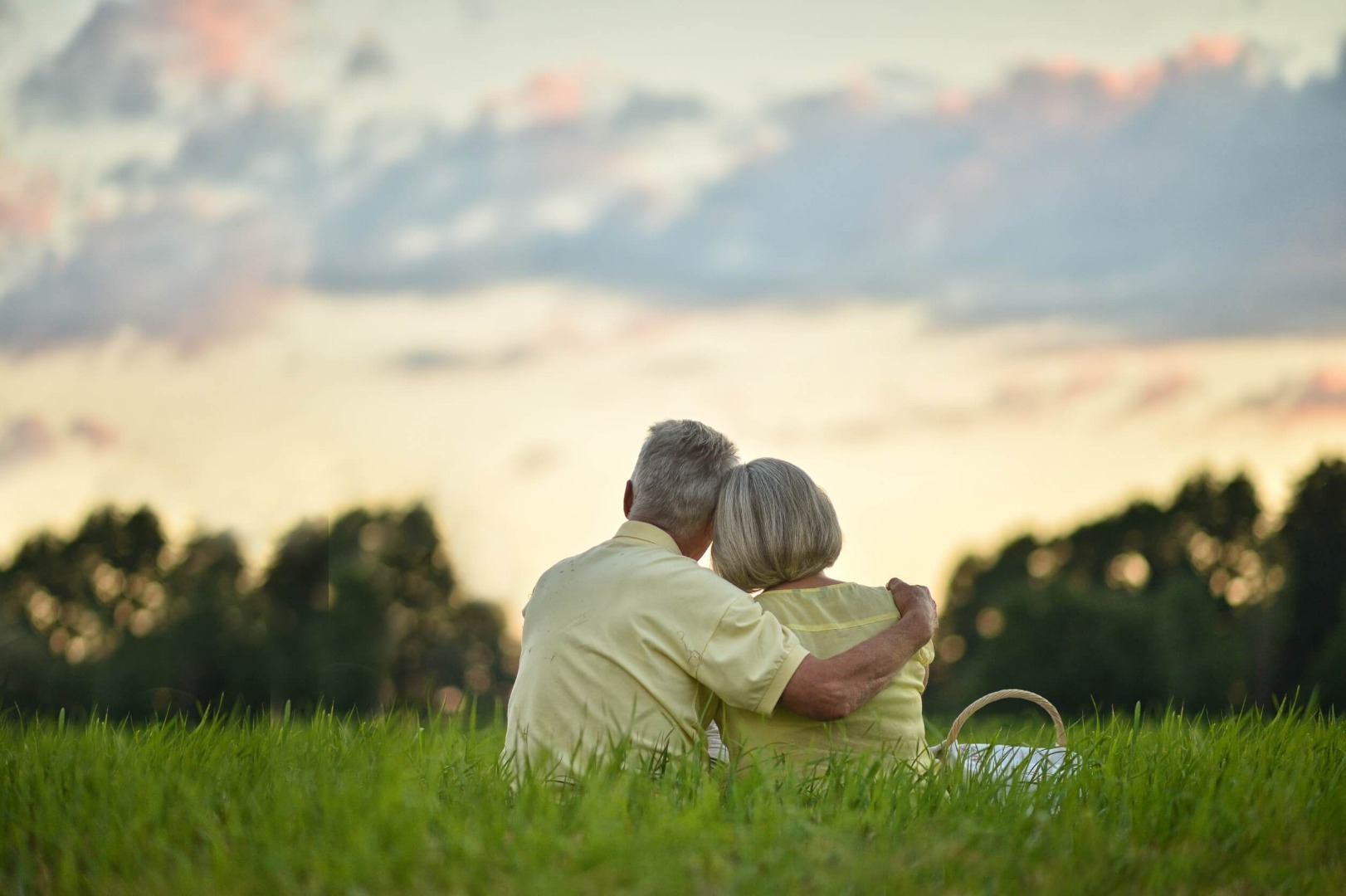 Elderly couple hugging