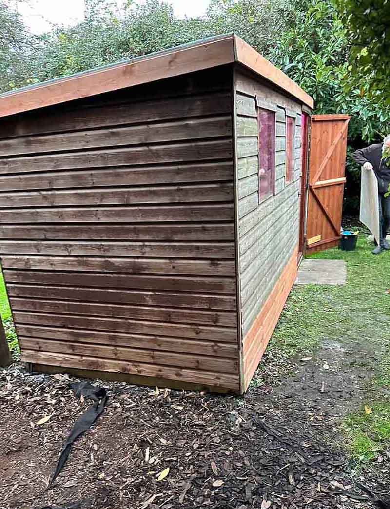 Dark brown wood shed