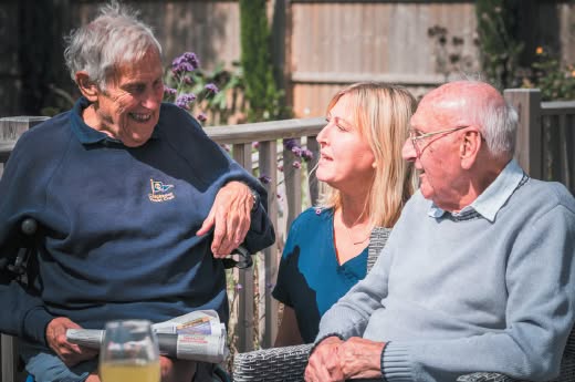 Happy old people speak in the garden