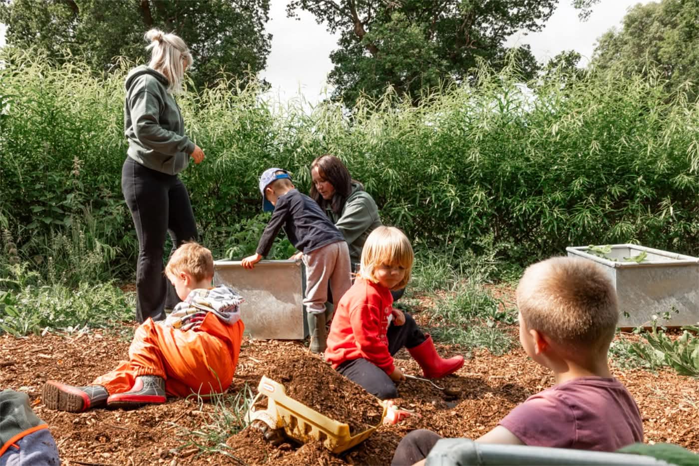 Children playing in bark