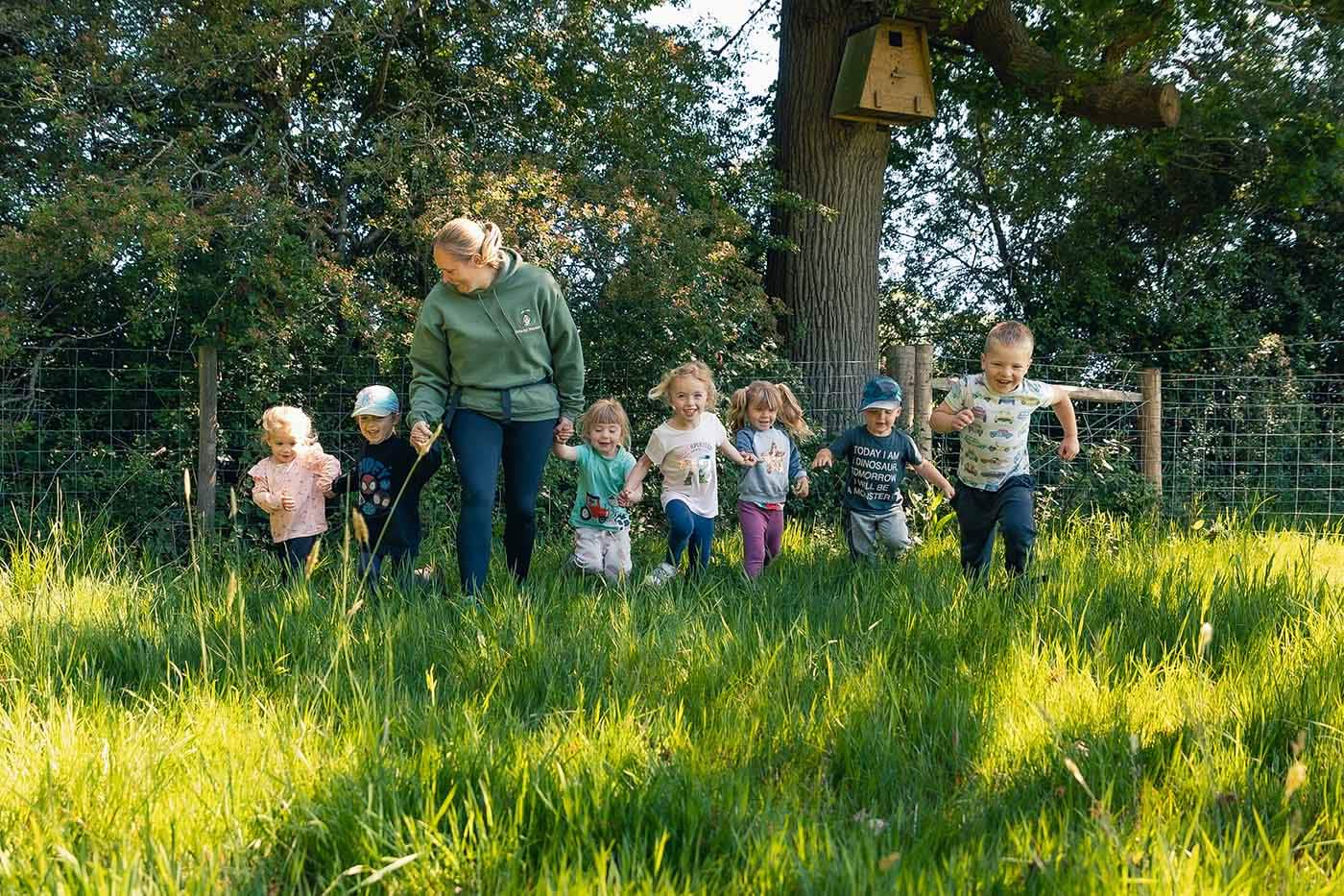 Children running with a woman 2