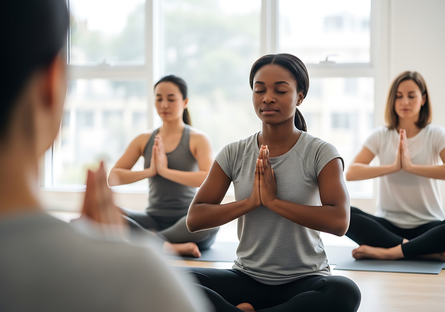 Meditating in a yoga class
