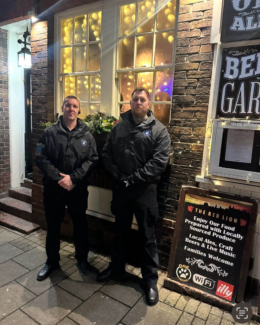 Two doormen red lion