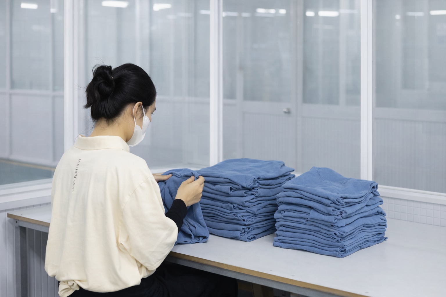 Woman folding clothes
