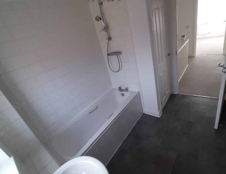 Empty bathroom open door