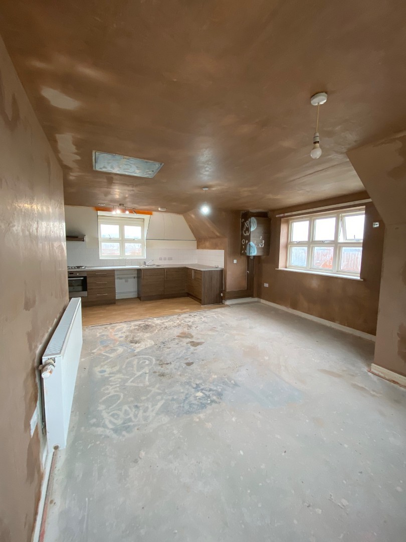 Freshly plastered room opposite end