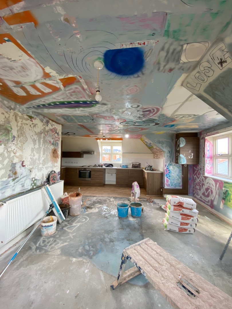 Graffitied room opposite end