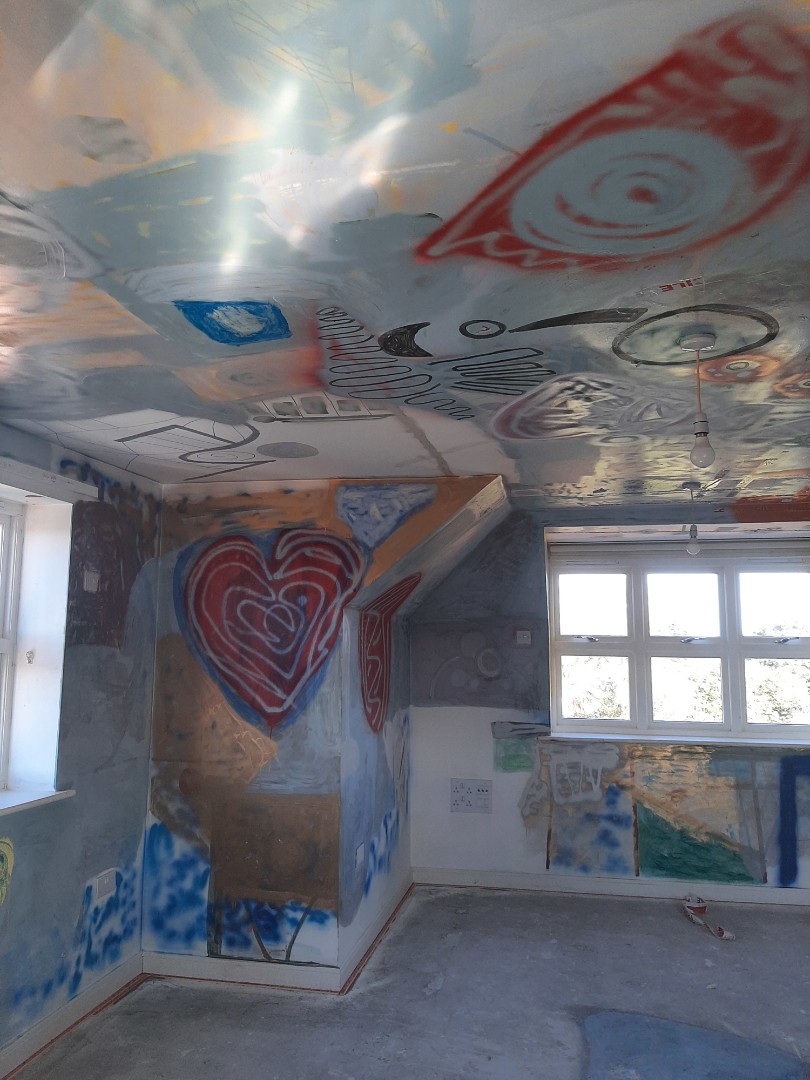 Opposite graffitied room corner