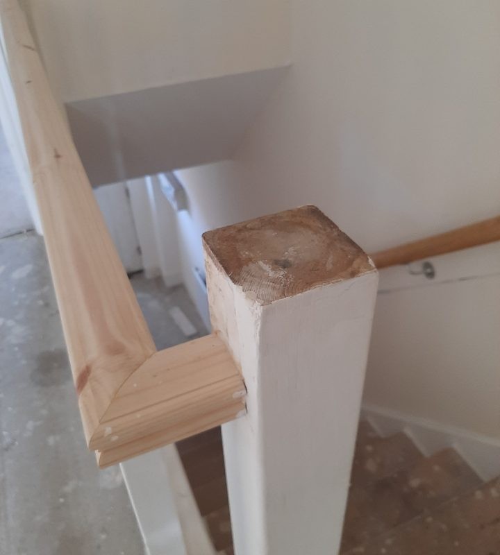 Partially painted banister post