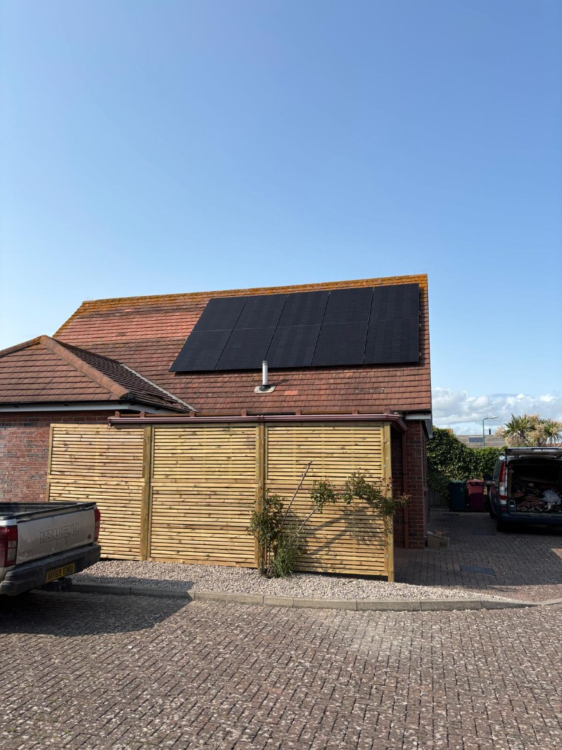 Solar panels covering house roof