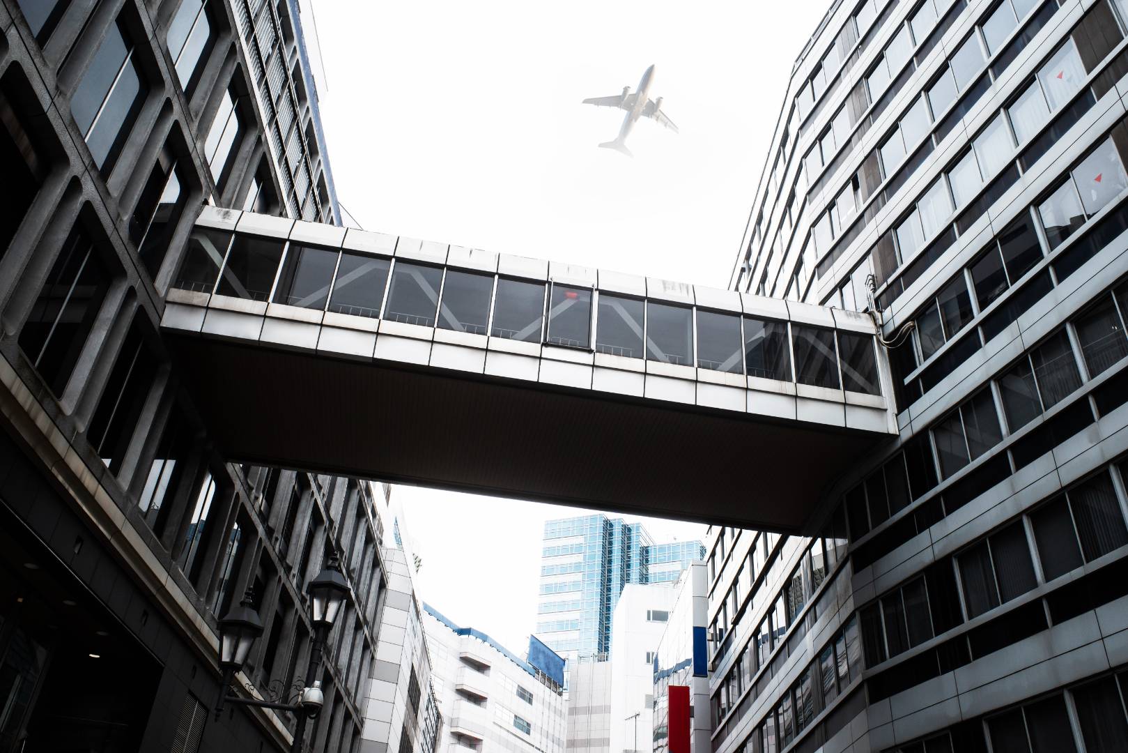 Landscape with plane flying sky