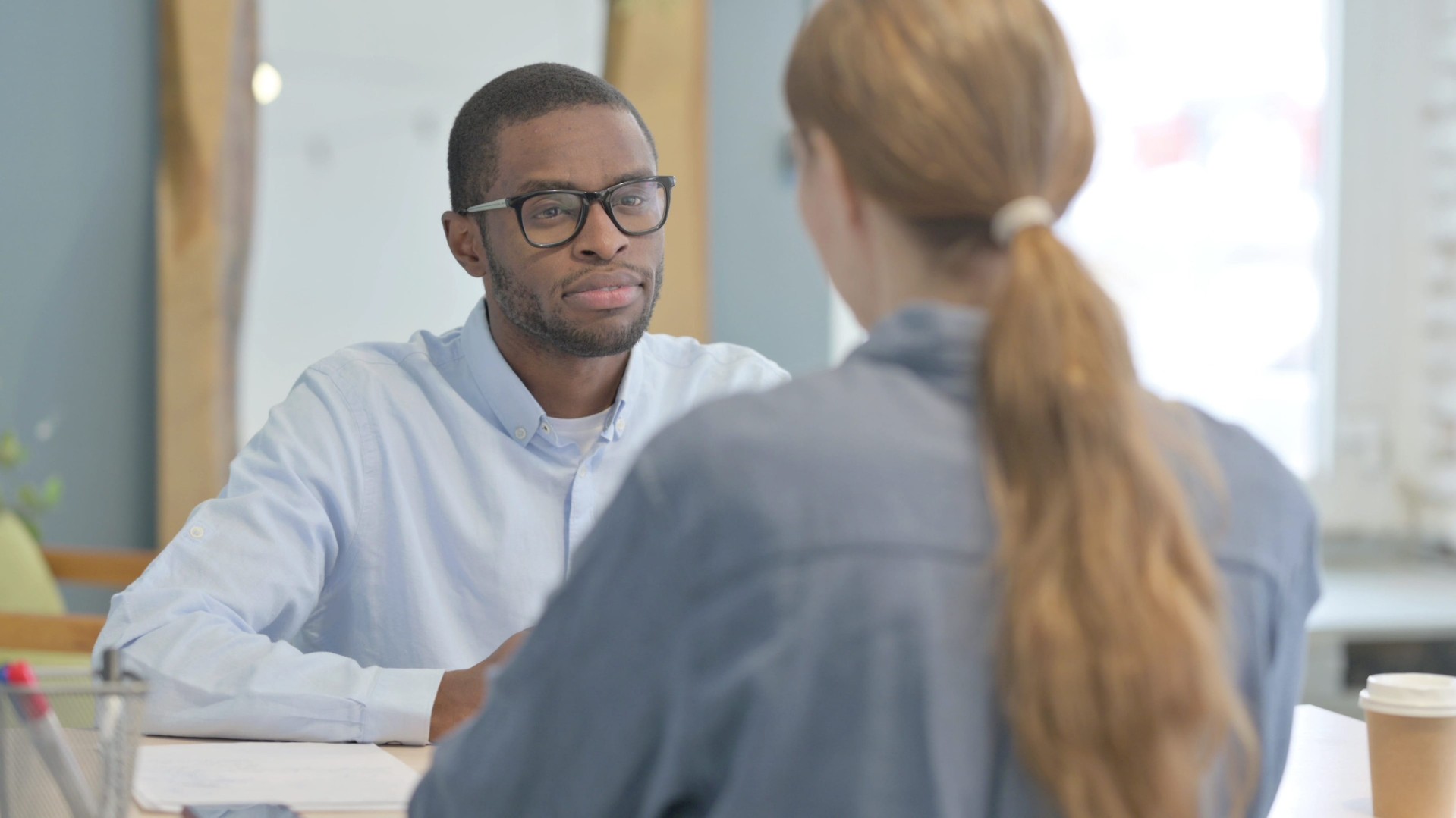 man talking with woman
