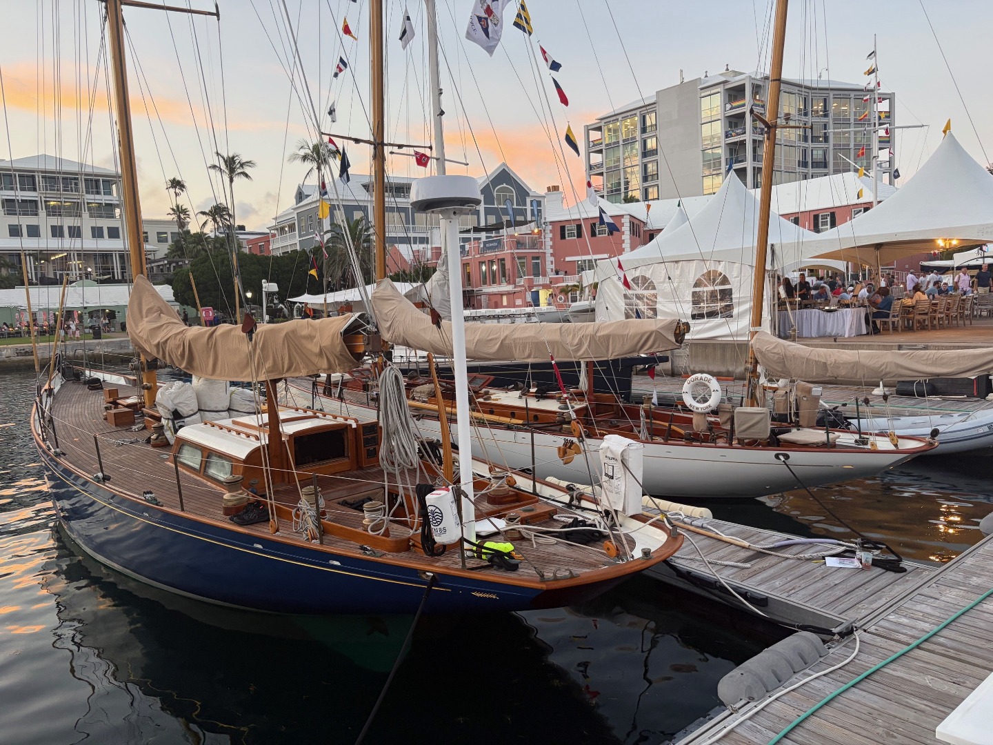 Classic yacht designs Gesture and Dorade alongside at the Royal Bermuda Yacht Club at the finish of the 2026 Newport Bermuda Yacht Race.