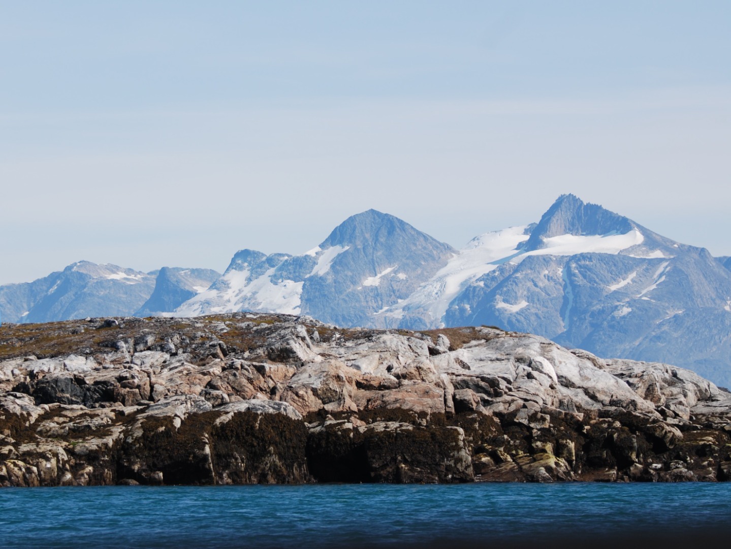 The inside channels of the west coast of Greenland, protected from the Davis Strait / Labrador Sea by a chain of offshore islands. Photograph taken looking towards the Greenland ice cap while cruising in high latitudes on the yacht Santana, with Merfyn Owen and Ashley Perrin in 2019.