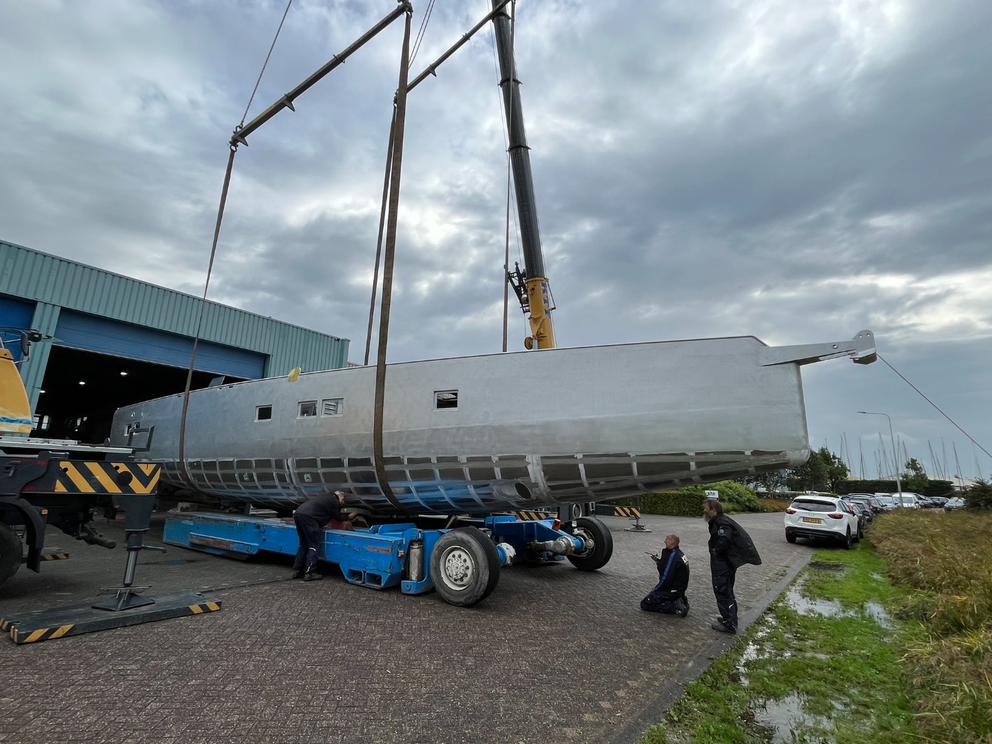 This is an Owen Clarke Design designed aluminium blue water centreboard explorer / expedition cruising yacht being turned over at KM Yachts in 2023.