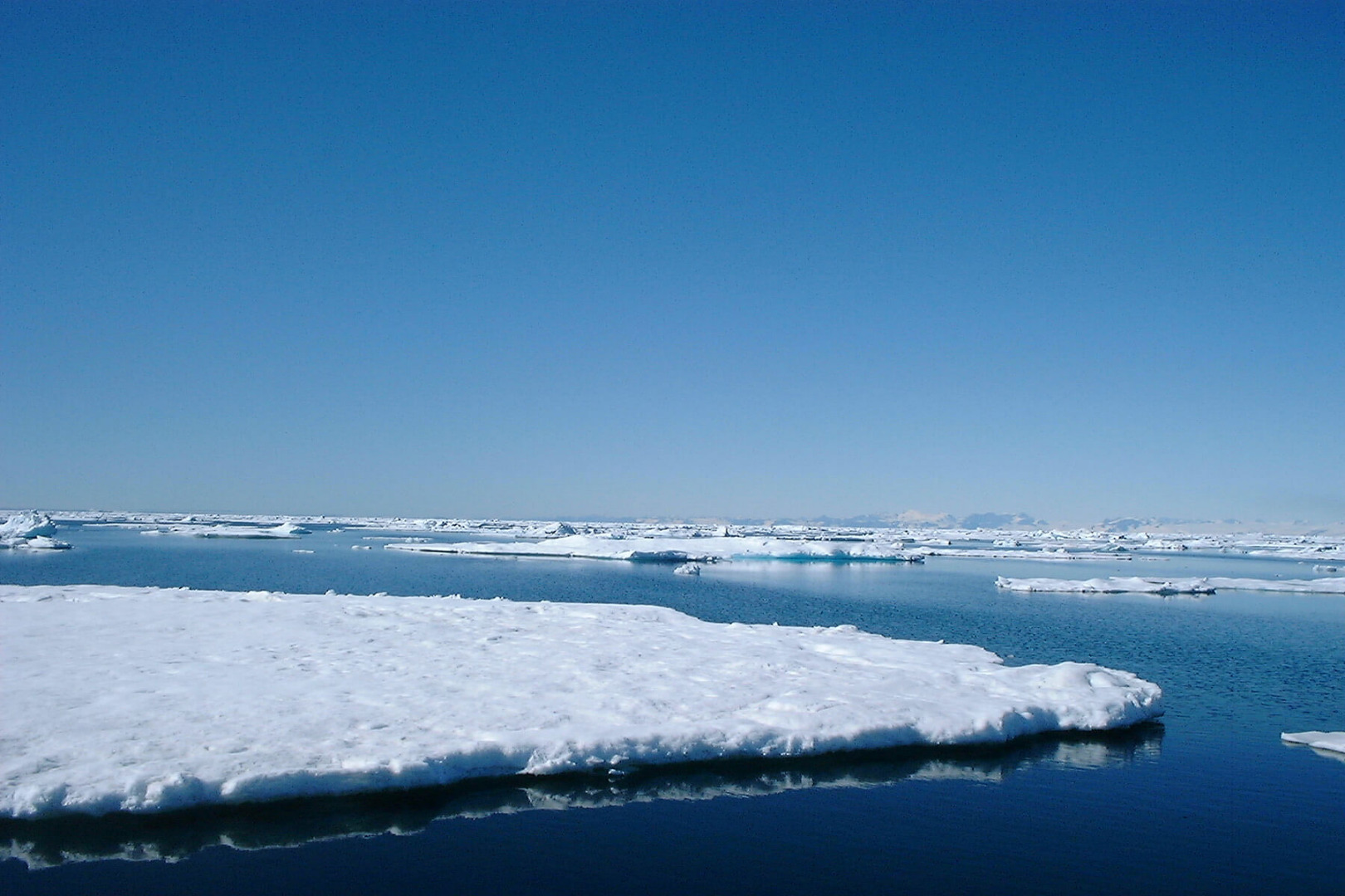 This photograph of ice flows off East Greenland above the Arctic Circle, was taken by yacht designer Merfyn Owen during an expedition in 2004. As part of Owen Clarke Design, he now helps design ice strengthened yachts which also allow for ice accretion in high latitudes