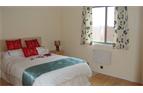 Double bedroom with large wardrobes.
Views across the field to the sea