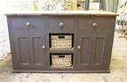 Dark brown sideboard with pitch pine top and centre baskets.

£780