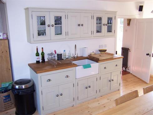 Large sink run with matching wall units with solid maple worktop and reclaimed belfast sink.

£2000 inc sink and taps.
